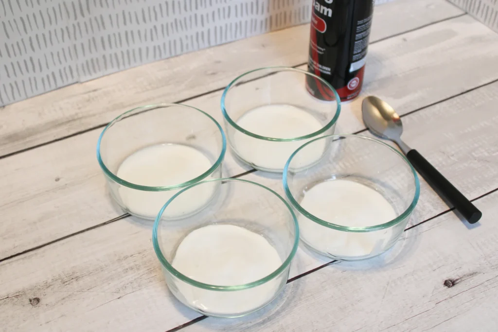 Glass bowls filled with white glue, prepped for adding shaving cream.
