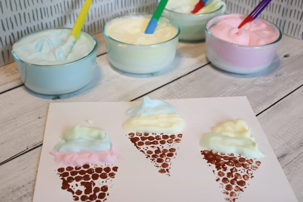 Puffy paint added to the tops of bubble wrap cones, forming colorful ice cream scoops.