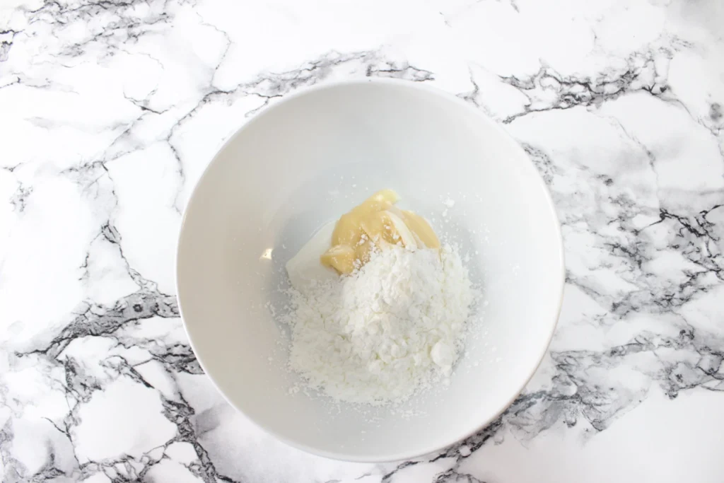 Banana pudding and cornstarch in a white bowl
