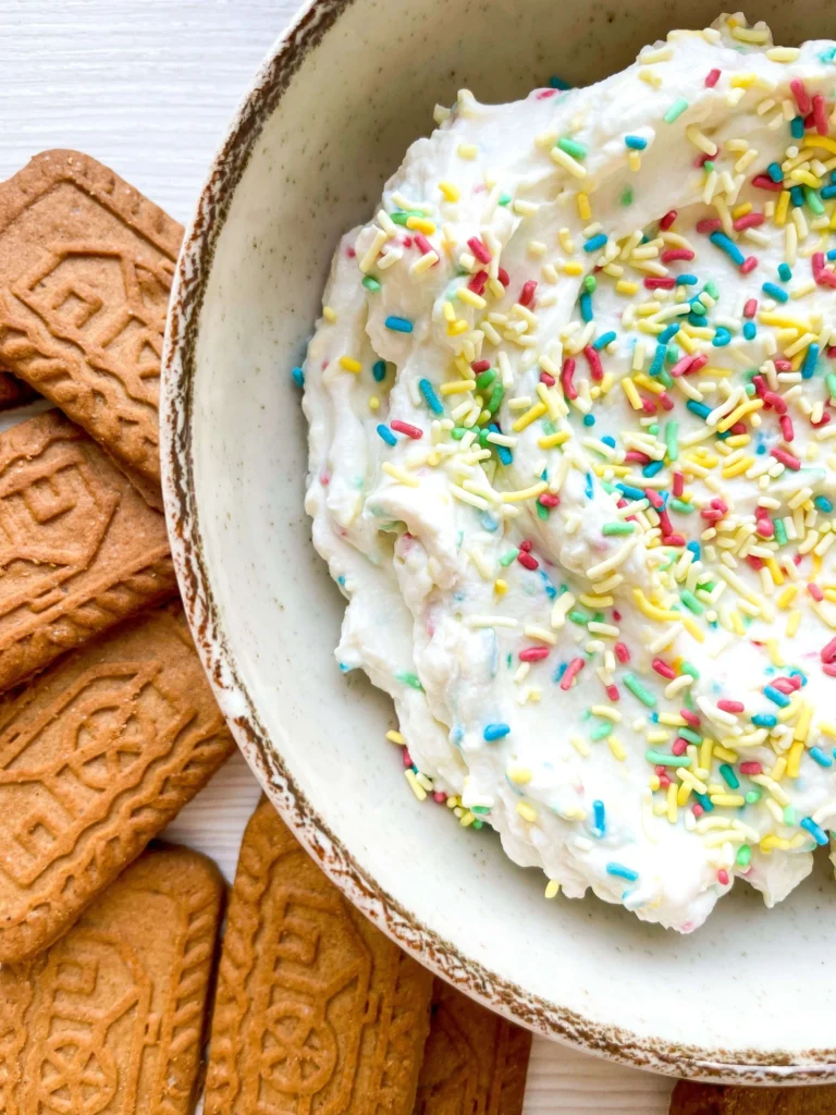 Detailed close-up showing the creamy texture of confetti dip with colorful sprinkles.