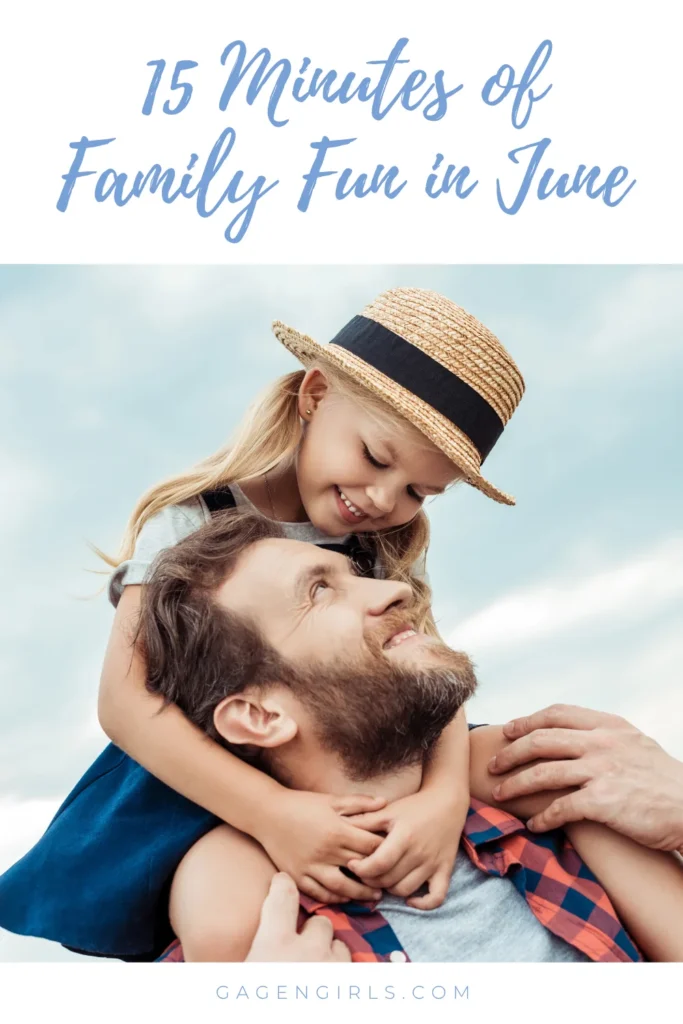 Young girl hugging her father outdoors during summer family fun time.