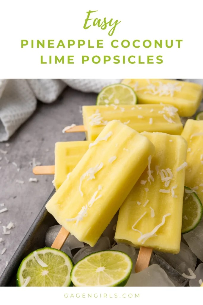Homemade pineapple coconut lime popsicles on ice with fresh lime slices for a refreshing summer treat.