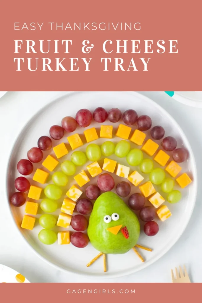 Thanksgiving fruit and cheese turkey tray made with grapes, cheese, and a pear