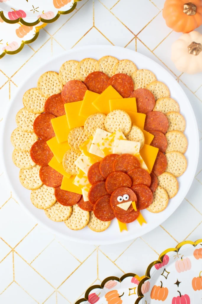 Thanksgiving turkey snack tray made with crackers, cheese, and pepperoni
